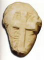 Head of statue exorcised by a cross